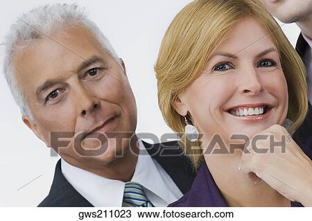 Portrait of a businessman and a businesswoman smiling View Large Photo Image Stock Image - Portrait of a businessman and a businesswoman smiling. Fotosearch