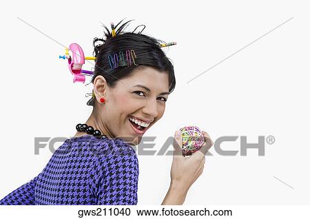 Portrait of a young woman holding rubber bands and smiling View Large Photo Image Stock Image - Portrait of a young woman holding rubber bands and smiling. Fotosearch
