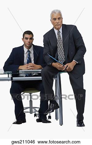 Stock Photograph - Portrait of two businessmen in an office. Fotosearch