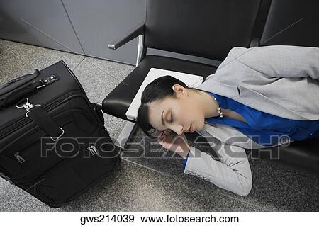 High angle view of a businesswoman sleeping View Large Photo Image Stock Photo - High angle view of a businesswoman sleeping. Fotosearch