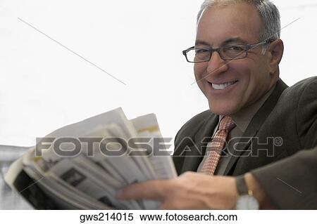 Stock Photography - Portrait of a businessman smiling. Fotosearch