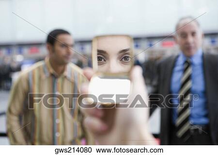 Reflection of a young woman's eyes on her hand mirror View Large Photo Image Stock Image - Reflection of a young woman's eyes on her hand mirror. Fotosearch