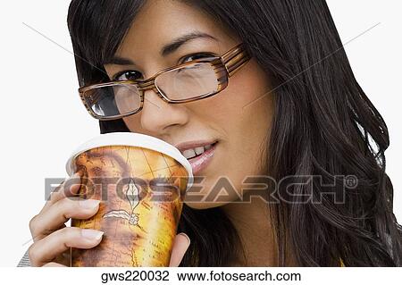 Portrait of a young woman drinking cold drink View Large Photo Image Stock Image - Portrait of a young woman drinking cold drink. Fotosearch