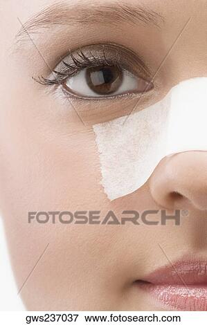 Close-up of an adhesive bandage on a patient's nose View Large Photo Image Stock Photo - Close-up of an adhesive bandage on a patient's nose. Fotosearch