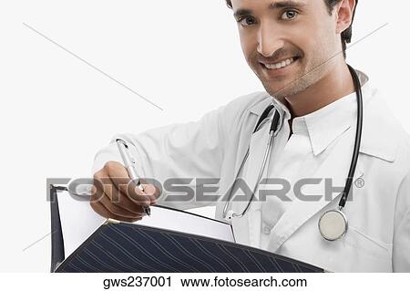 Stock Image - Portrait of a male doctor holding a pen. Fotosearch