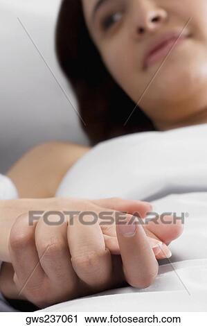 Young woman holding hand's of a man View Large Photo Image Stock Image - Young woman holding hand's of a man. Fotosearch