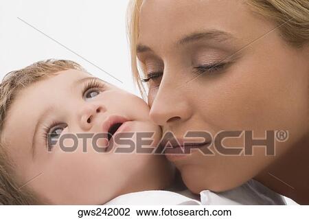 Close-up of a mid adult woman loving her son View Large Photo Image Stock Image - Close-up of a mid adult woman loving her son. Fotosearch