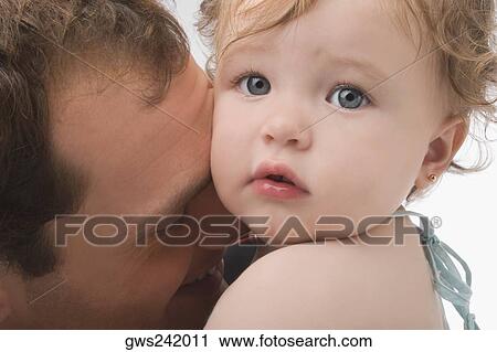 Close-up of a young man loving his daughter View Large Photo Image Stock Image - Close-up of a young man loving his daughter. Fotosearch