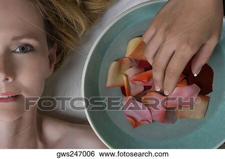 Close-up of a mature woman lying on a massage table View Large Photo Image Stock Photograph - Close-up of a mature woman lying on a massage table. Fotosearch