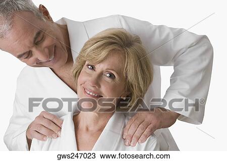 Close-up of a mature woman smiling with a senior man looking at her face View Large Photo Image Stock Image - Close-up of a mature woman smiling with a senior man looking at her face. Fotosearch