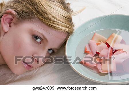 Stock Photo - Close-up of a teenage girl on a massage table. Fotosearch