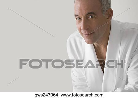 Portrait of a senior man wearing a bathrobe and smiling View Large Photo Image Picture - Portrait of a senior man wearing a bathrobe and smiling. Fotosearch