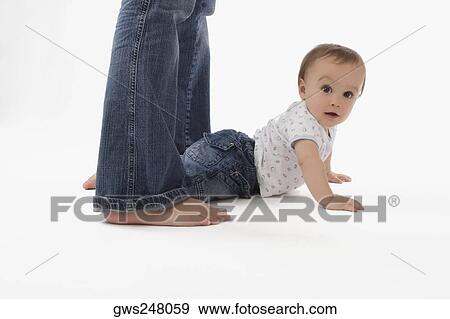 Portrait of a baby boy lying on the floor View Large Photo Image Stock Photo - Portrait of a baby boy lying on the floor. Fotosearch