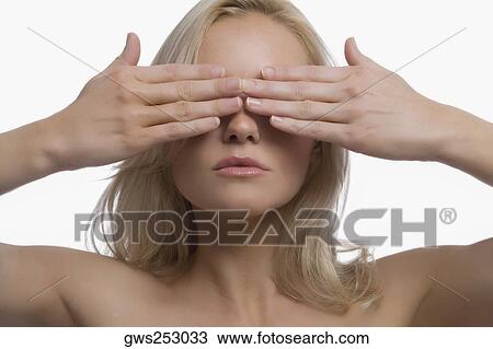 Close-up of a young woman covering her eyes with her hands View Large Photo Image Stock Image - Close-up of a young woman covering her eyes with her hands. Fotosearch