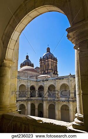 Stock Image - Art museum viewed through an arch, Santo Domingo, Oaxaca, Oaxaca State, Mexico. Fotosearch