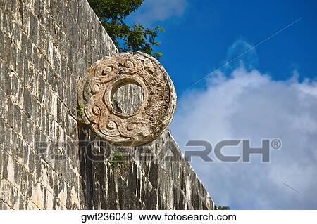 Circular carved stone on the wall, Ball Court Ring, Chichen Itza, Yucatan, Mexico View Large Photo Image Stock Photo - Circular carved stone on the wall, Ball Court Ring, Chichen Itza, Yucatan, Mexico. Fotosearch