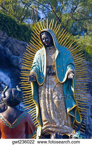 Low angle view of a statue of Virgin Mary, Virgin of Guadalupe, Tepeyac, Mexico city, Mexico View Large Photo Image Stock Image - Low angle view of a statue of Virgin Mary, Virgin of Guadalupe, Tepeyac, Mexico city, Mexico. Fotosearch