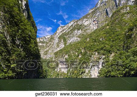 Panoramic view of a lake with a mountain range in the background, Sumidero Canyon, Chiapas, Mexico View Large Photo Image Stock Image - Panoramic view of a lake with a mountain range in the background, Sumidero Canyon, Chiapas, Mexico. Fotosearch