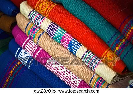 Stock Photography - Close-up of a stack of multi-colored shawls, Santo Tomas Jalieza, Oaxaca State, Mexico. Fotosearch
