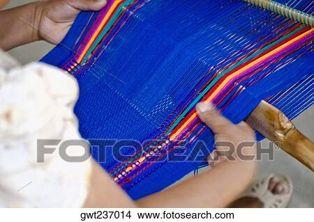 Close-up of a woman weaving textile, Santo Tomas Jalieza, Oaxaca State, Mexico View Large Photo Image Picture - Close-up of a woman weaving textile, Santo Tomas Jalieza, Oaxaca State, Mexico. Fotosearch