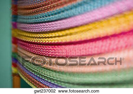 Stock Image - Close-up of multi-colored threads, Izamal, Yucatan, Mexico. Fotosearch