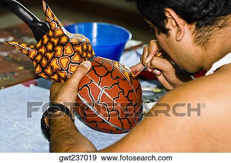 Rear view of a man painting on ceramics, Arrazola, Oaxaca State, Mexico View Large Photo Image Stock Photo - Rear view of a man painting on ceramics, Arrazola, Oaxaca State, Mexico. Fotosearch