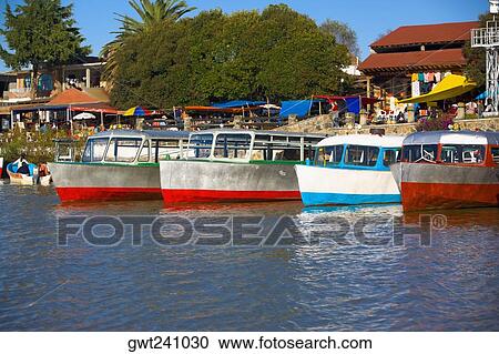 Stock Image - Boats moored at a harbor, Lake Patzcuaro, Patzcuaro, Michoacan State, Mexico. Fotosearch