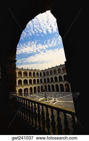 Stock Photo - Government building viewed through an arch, National Palace, Zocalo, Mexico City, Mexico. Fotosearch