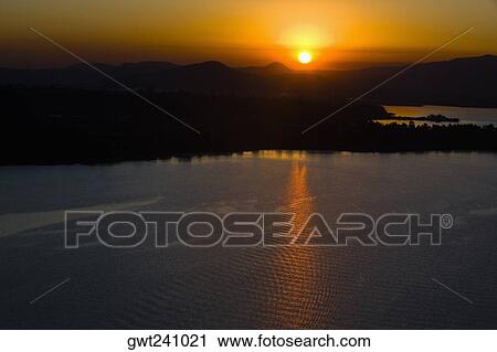 Sunset over a mountain range, Janitzio Island, Lake Patzcuaro, Morelia, Michoacan State, Mexico View Large Photo Image Stock Image - Sunset over a mountain range, Janitzio Island, Lake Patzcuaro, Morelia, Michoacan State, Mexico. Fotosearch