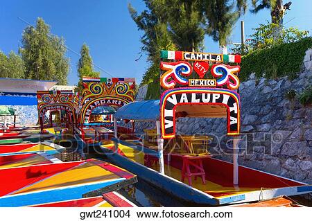 Trajineras boats moored in a canal, Xochimilco Gardens, Mexico City, Mexico View Large Photo Image Picture - Trajineras boats moored in a canal, Xochimilco Gardens, Mexico City, Mexico. Fotosearch