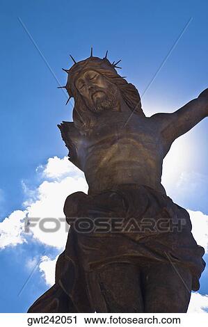 Stock Image - Low angle view of a statue of Jesus Christ, Broken Christ, San Jose De Gracia, Aguascalientes, Mexico. Fotosearch