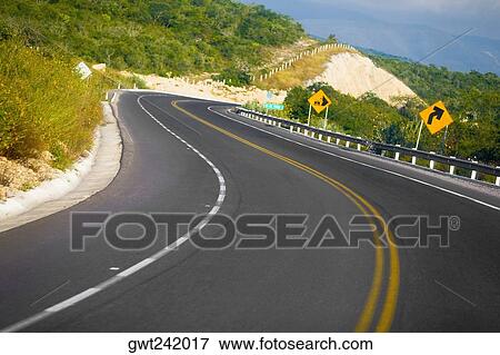 Road passing through mountains, San Luis Potosi, Mexico View Large Photo Image Stock Photo - Road passing through mountains, San Luis Potosi, Mexico. Fotosearch