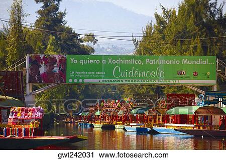 Trajineras boats in a canal, Xochimilco Gardens, Mexico City, Mexico View Large Photo Image Stock Image - Trajineras boats in a canal, Xochimilco Gardens, Mexico City, Mexico. Fotosearch