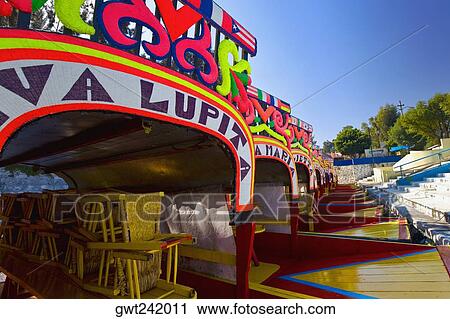 Trajineras boats in a row, Xochimilco Gardens, Mexico City, Mexico View Large Photo Image Stock Image - Trajineras boats in a row, Xochimilco Gardens, Mexico City, Mexico. Fotosearch