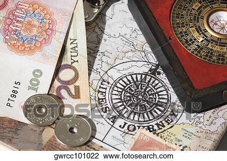 Chinese coins and a feng shui compass on a map View Large Photo Image Stock Image - Chinese coins and a feng shui compass on a map. Fotosearch