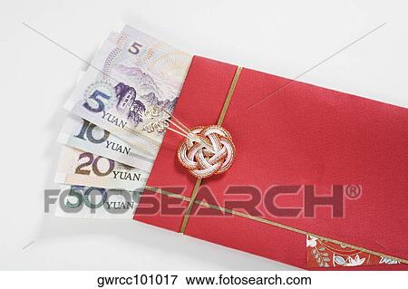 Chinese currency in a red envelope View Large Photo Image Stock Photo - Chinese currency in a red envelope. Fotosearch