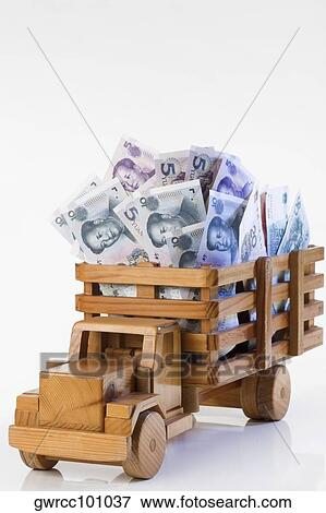 Chinese Yuan notes loaded into a toy truck View Large Photo Image Stock Photo - Chinese Yuan notes loaded into a toy truck. Fotosearch