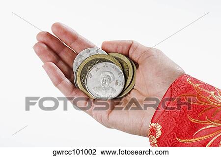 Close-up of a person's hand holding Chinese coins View Large Photo Image Stock Image - Close-up of a person's hand holding Chinese coins. Fotosearch