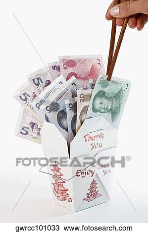 Close-up of a person's hand picking Chinese paper currency in a Chinese takeout box View Large Photo Image Stock Image - Close-up of a person's hand picking Chinese paper currency in a Chinese takeout box. Fotosearch