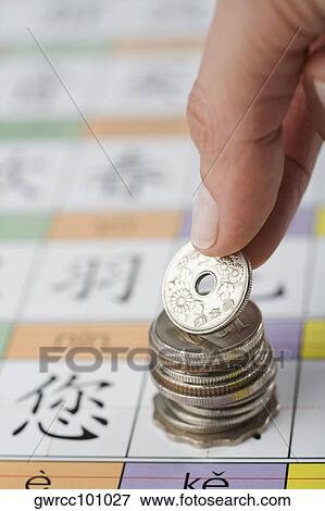 Close-up of a person's hand putting coin View Large Photo Image Stock Photo - Close-up of a person's hand putting coin. Fotosearch