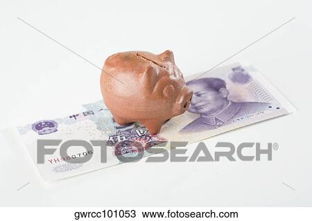 Close-up of a piggy bank on Chinese currency View Large Photo Image Stock Image - Close-up of a piggy bank on Chinese currency. Fotosearch
