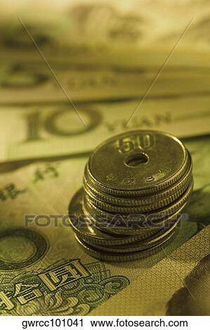 Close-up of a stack of Chinese coins on paper currency View Large Photo Image Stock Image - Close-up of a stack of Chinese coins on paper currency. Fotosearch
