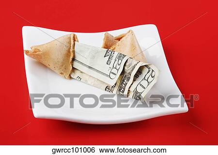 Close-up of a twenty dollar bill in a fortune cookie View Large Photo Image Stock Photograph - Close-up of a twenty dollar bill in a fortune cookie. Fotosearch