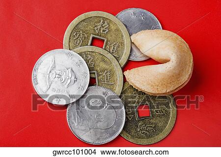 Close-up of Chinese coins with fortune cookie View Large Photo Image Picture - Close-up of Chinese coins with fortune cookie. Fotosearch