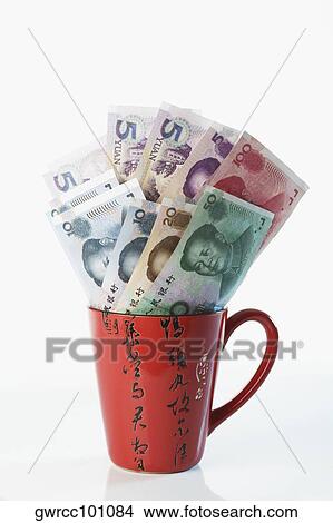 Close-up of Chinese currency in a cup View Large Photo Image Picture - Close-up of Chinese currency in a cup. Fotosearch