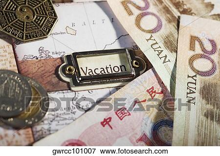 Close-up of Chinese currency on a map View Large Photo Image Stock Photo - Close-up of Chinese currency on a map. Fotosearch