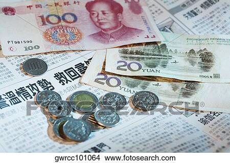 Close-up of Chinese currency on a newspaper View Large Photo Image Picture - Close-up of Chinese currency on a newspaper. Fotosearch