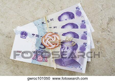 Close-up of Chinese currency tied with a ribbon View Large Photo Image Stock Image - Close-up of Chinese currency tied with a ribbon. Fotosearch