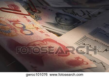 Close-up of Chinese Yuan note and financial newspaper View Large Photo Image Stock Photograph - Close-up of Chinese Yuan note and financial newspaper. Fotosearch