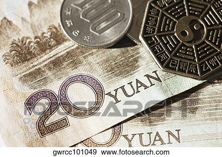Close-up of coins on Chinese paper currency View Large Photo Image Stock Photo - Close-up of coins on Chinese paper currency. Fotosearch